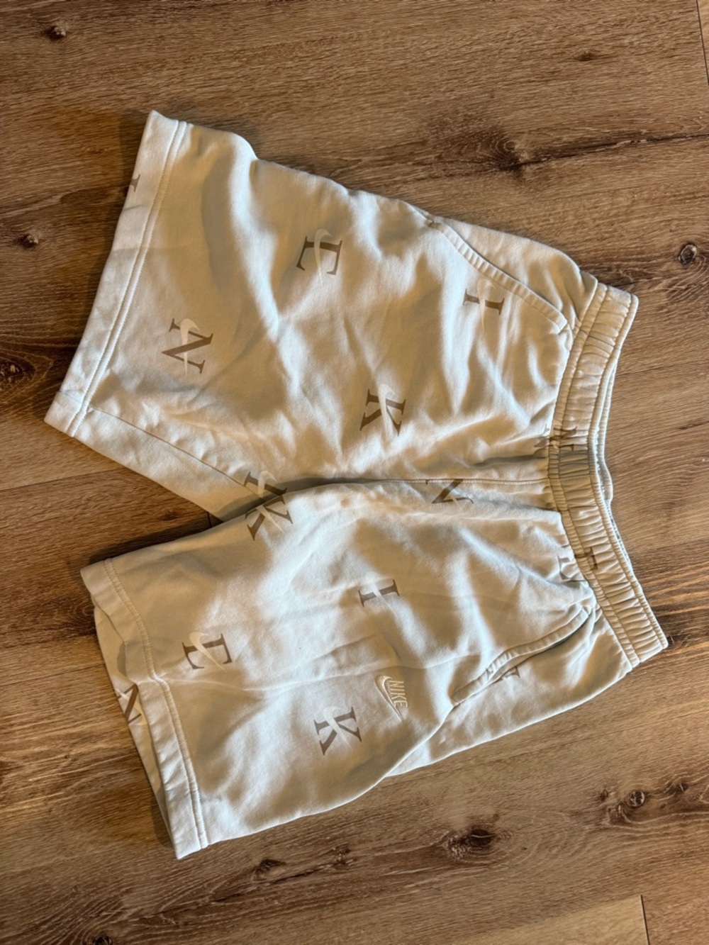 Nike Men’s Cream All-Over Logo Athletic Shorts